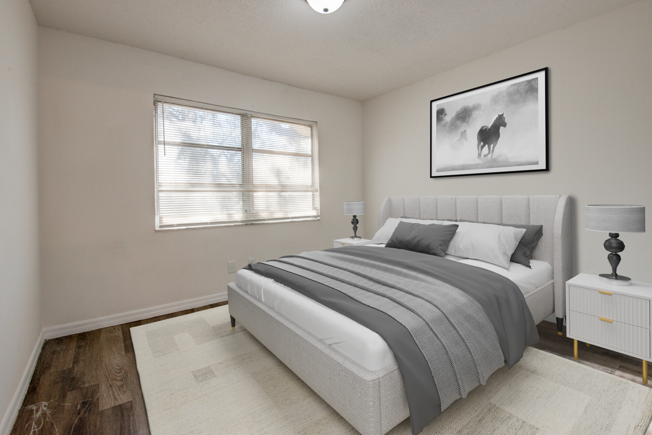 An empty bedroom has been virtually staged with a bed, rug, night stand, and large photo on the wall